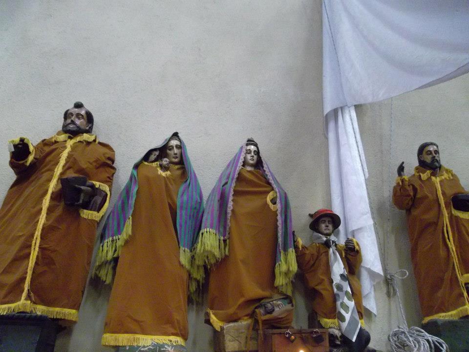 Inside the Church of Santiago Atitlán. The local women make clothes for these statues of the saints every year.